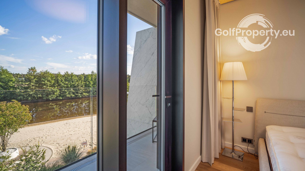 Luxury apartment by the lake with a private beach.