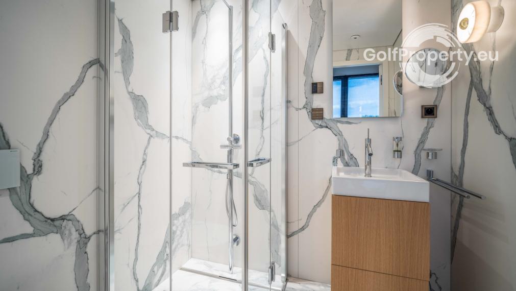 Luxury apartment by the lake with a private beach.