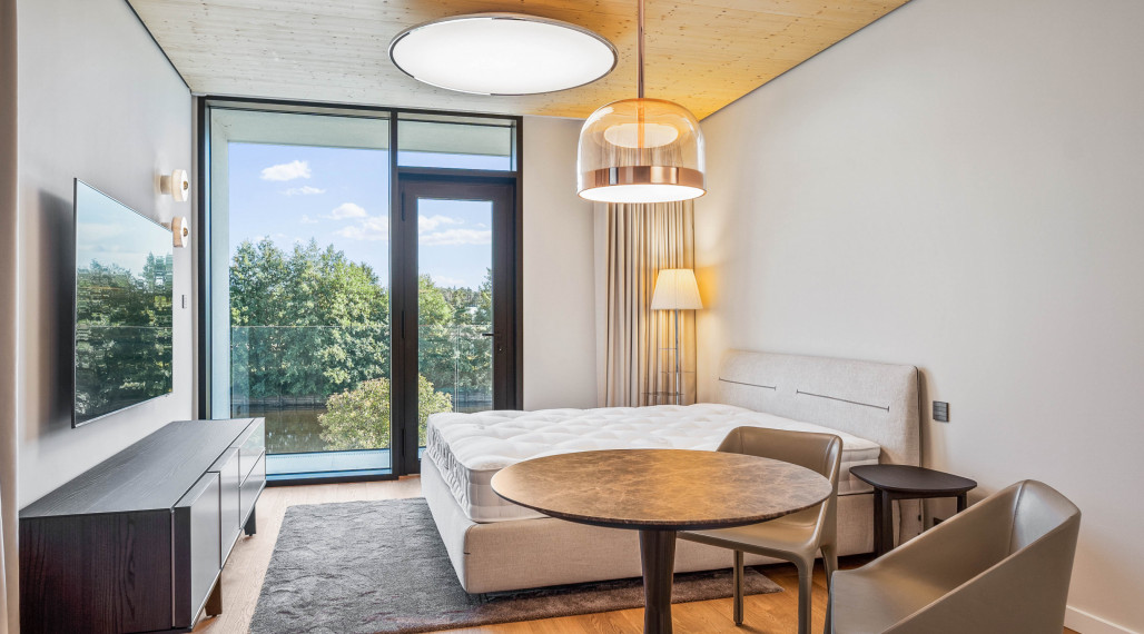 Luxury apartment by the lake with a private beach.