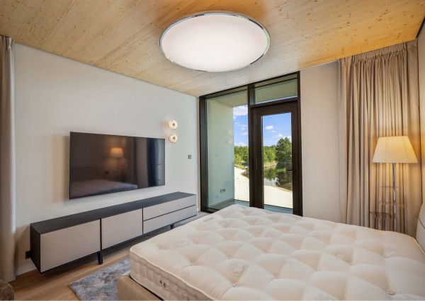 Luxury apartment by the lake with a private beach.